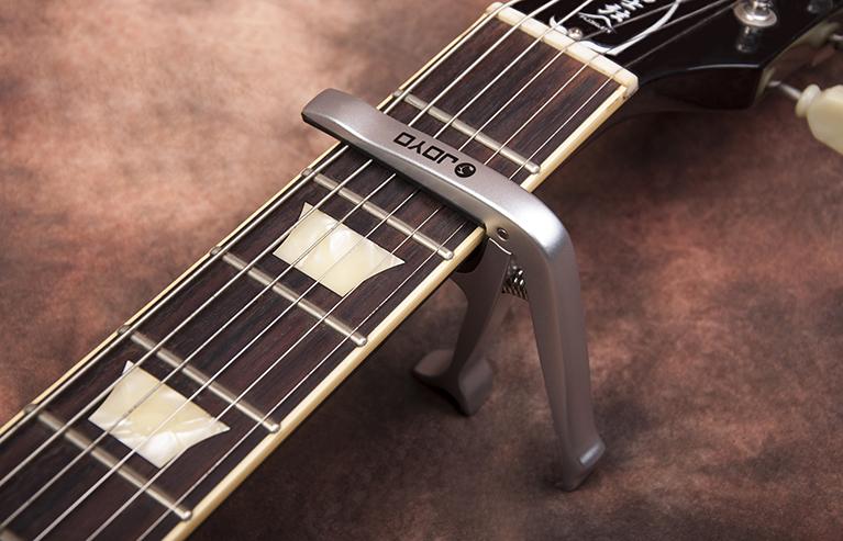 Joyo JCP-02 Multifunction Guitar Capo + Bottle Opener & Bridge Pin Puller - GuitarPusher